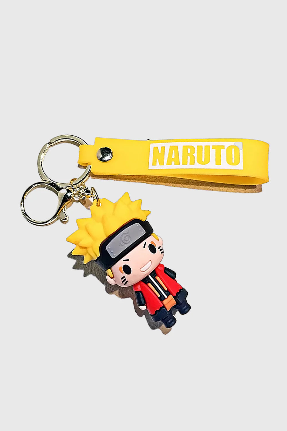 Show off your ninja spirit with this Naruto Uzumaki 3D PVC Keychain, featuring Naruto in his signature cloak and headband. Made from durable, high-quality PVC, this lightweight and stylish keyring includes a matching yellow "Naruto" wrist strap for extra